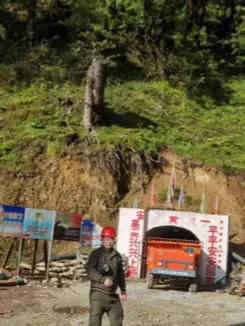 Mine portal entrance on a forested mountainside